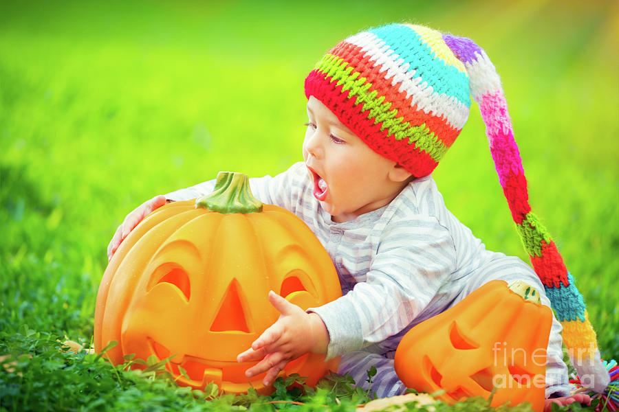 Cute baby with Halloween pumpkins Photograph by Anna Om