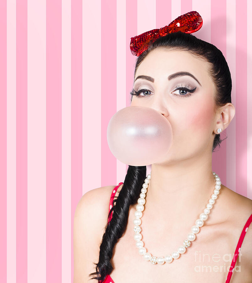 Cute candy store girl blowing chewing gum bubble Photograph by Jorgo Photography