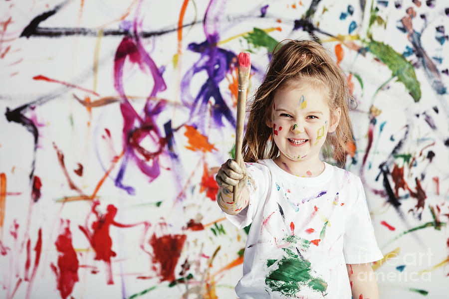 Cute child with smuges of colorful paint Photograph by Michal Bednarek