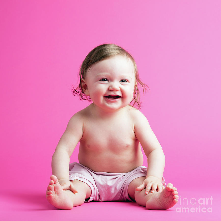 Cute toddler in a diaper on pink background Photograph by Michal Bednarek