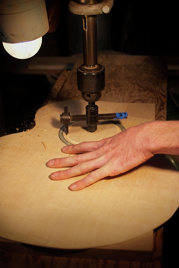 Cutting the Sound Hole Photograph by Grant Groberg