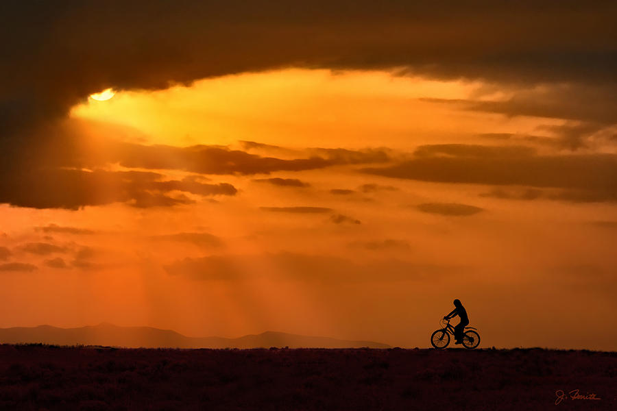Cycling Into Sunrays Photograph by Joe Bonita