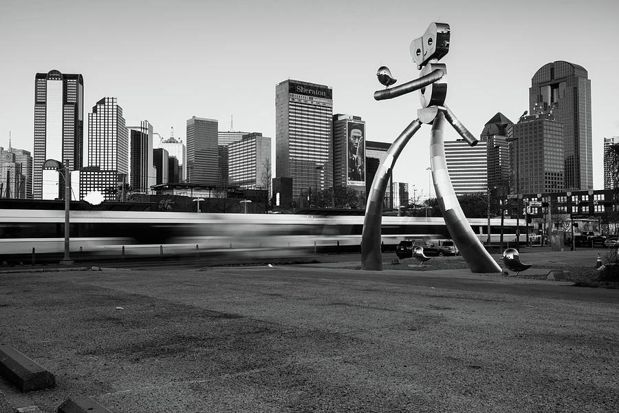 Dallas Texas Skyline and Traveling Man - Black and White Photograph by Gregory Ballos