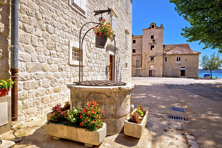 Dalmatian stone architecture and ancient well in Kastel Stafilic Photograph by Brch Photography