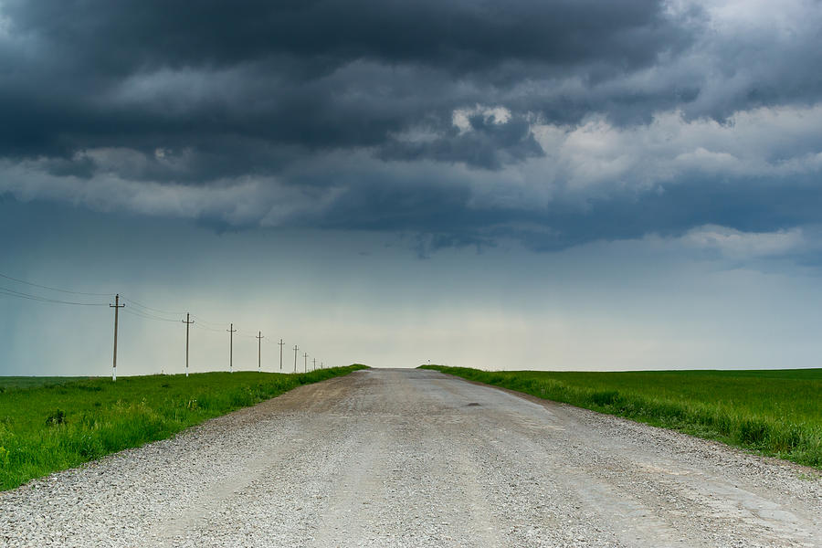 Dark Rain clouds Over Empty Road Photograph by John Williams