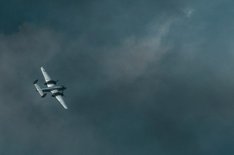 Dark skys with a B-25 Photograph by Brian Green