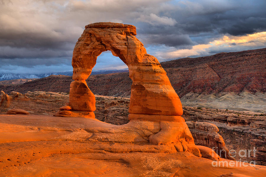 Dark Storm Clouds Over Delicate Arch Photograph by Adam Jewell