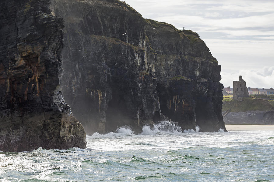 Dark Straight Cliffs With Waves Photograph