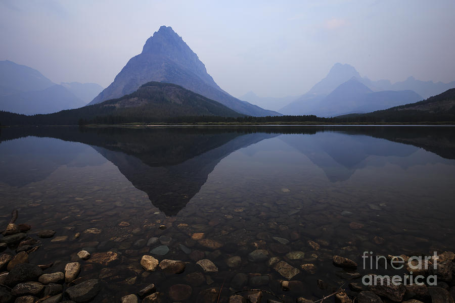 Dawn at Swiftcurrent Lake Photograph by Dennis Hedberg