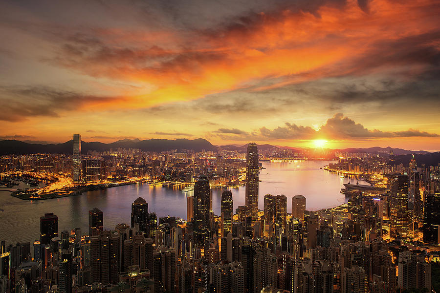 Day to night for Hong kong city sunrise Photograph by Anek Suwannaphoom