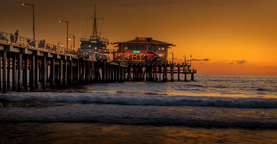 Daylight Turns Golden On The Pier Photograph by Gene Parks