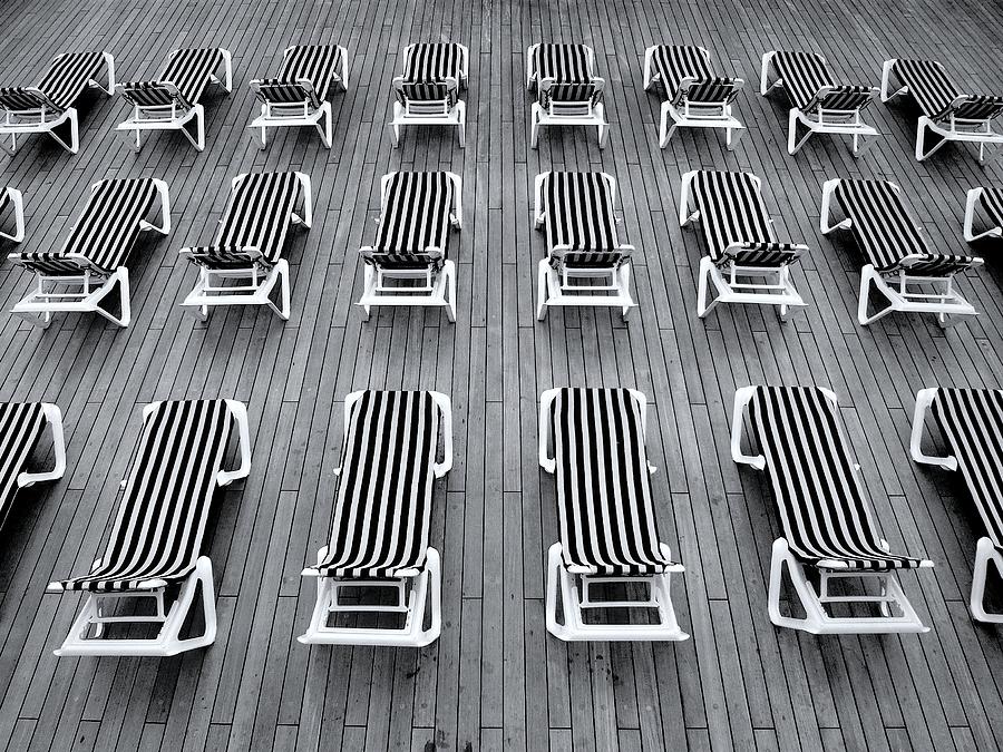 Black And White Photograph - Deck chairs by Michel Le
