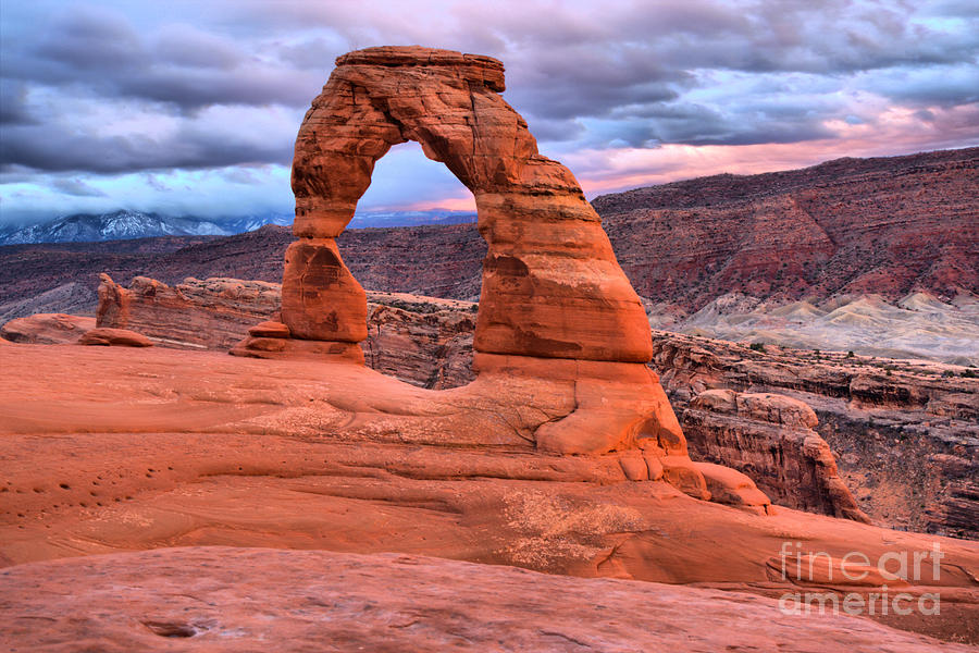 Delicate Arch Pastel Stormy Skies Photograph by Adam Jewell