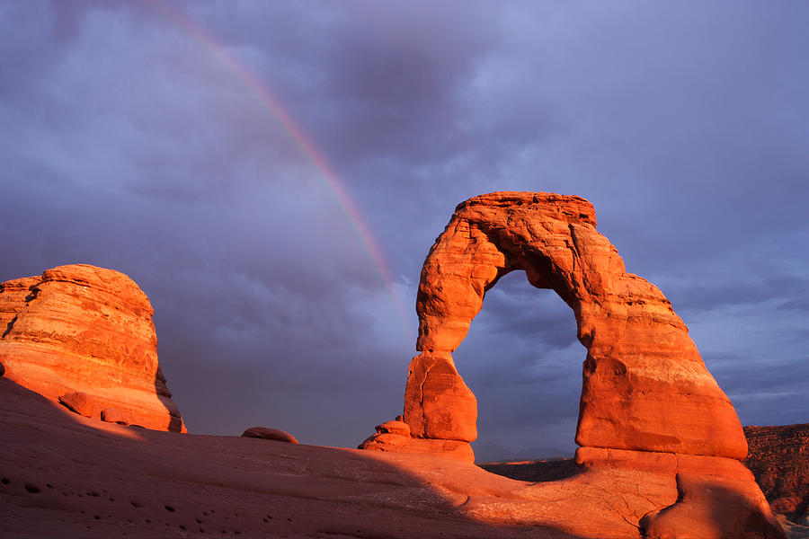 Delicate Arch Rainbow Photograph by Eric Foltz