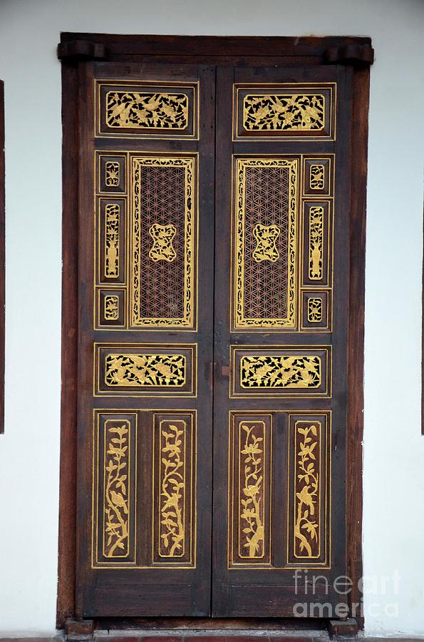 Delicate Peranakan wood carved door with gold inlay Penang Malaysia Photograph by Imran Ahmed