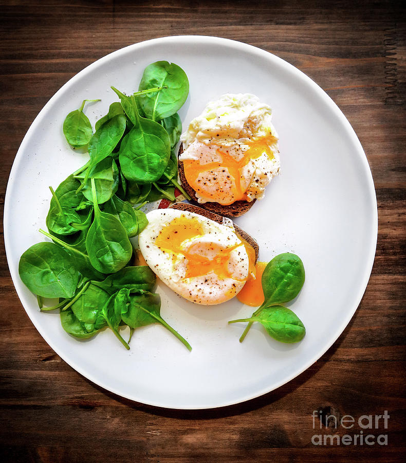 Delicious poached eggs Photograph by Anna Om