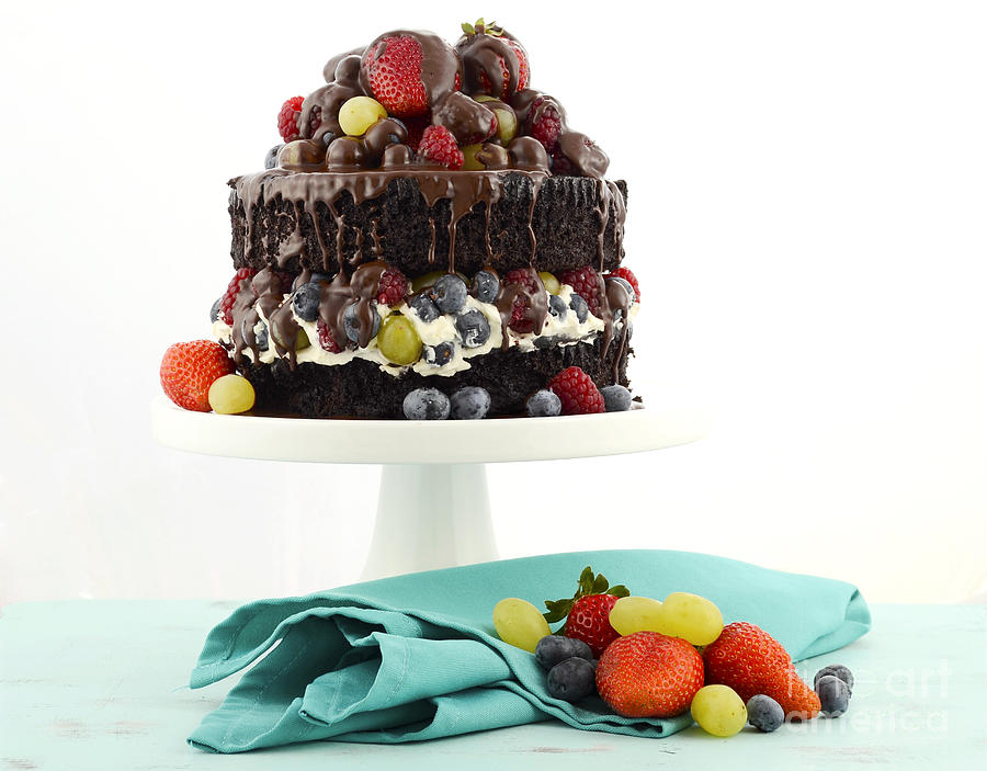 Deliciously divine chocolate cake with berries and cream.  Photograph by Milleflore Images