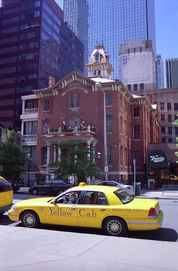 Denver Downtown with Yellow Cab Photograph by Frank Romeo