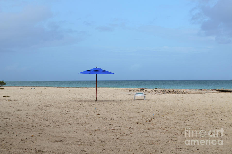 Deserted Beach with a Blue Umbrella on a White Sand Beach Photograph by DejaVu Designs