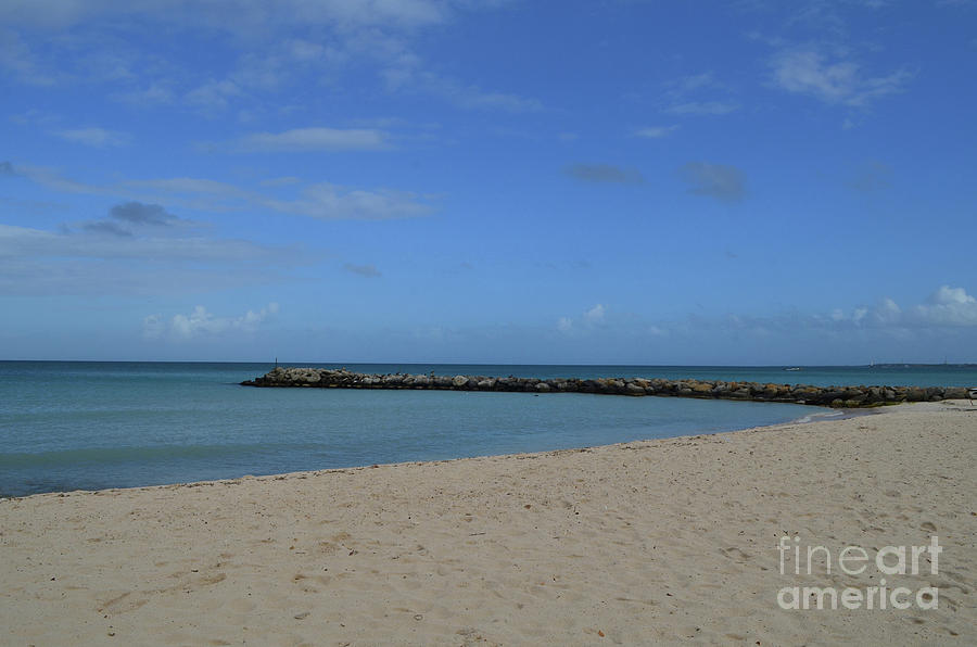 Deserted Rock Jetty Along the Beach in Aruba Photograph by DejaVu Designs