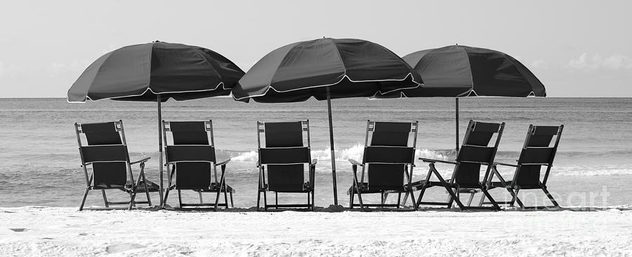 Destin Florida Six Beach Chairs and Three Umbrellas Panoramic Black and White Photograph by Shawn OBrien