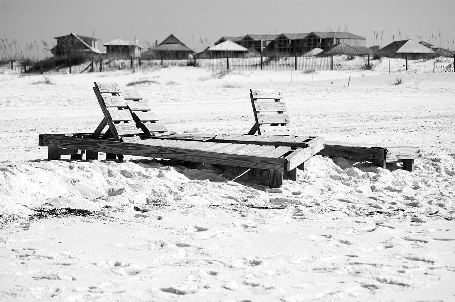 Destin Florida Wooden Beach Chairs on Sand with Beach Houses Black and White Photograph by Shawn OBrien