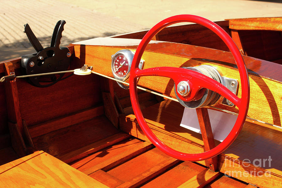 Detail of Wood Speed Boat with Bright Red Steering Wheel  Photograph by Susan Vineyard