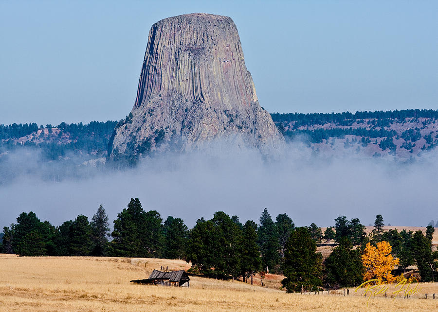 Devils Tower Standing In Fog Photograph