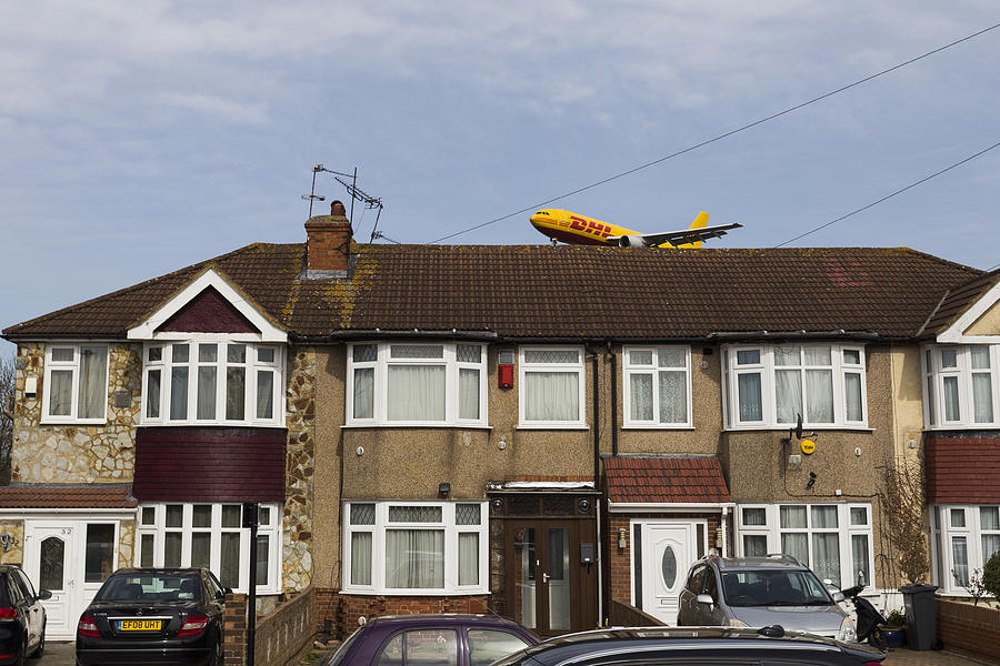 London Photograph - DHL Airbus A300 Emerging From A House by David Pyatt