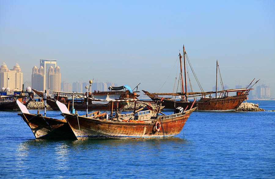 Dhows in Doha Bay Photograph by Paul Cowan