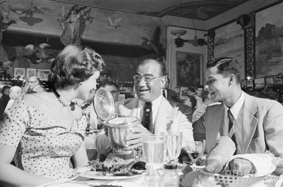 New Orleans Photograph - Diamond Jim Moran, entertaining guests at his restaurant in New  by The Harrington Collection