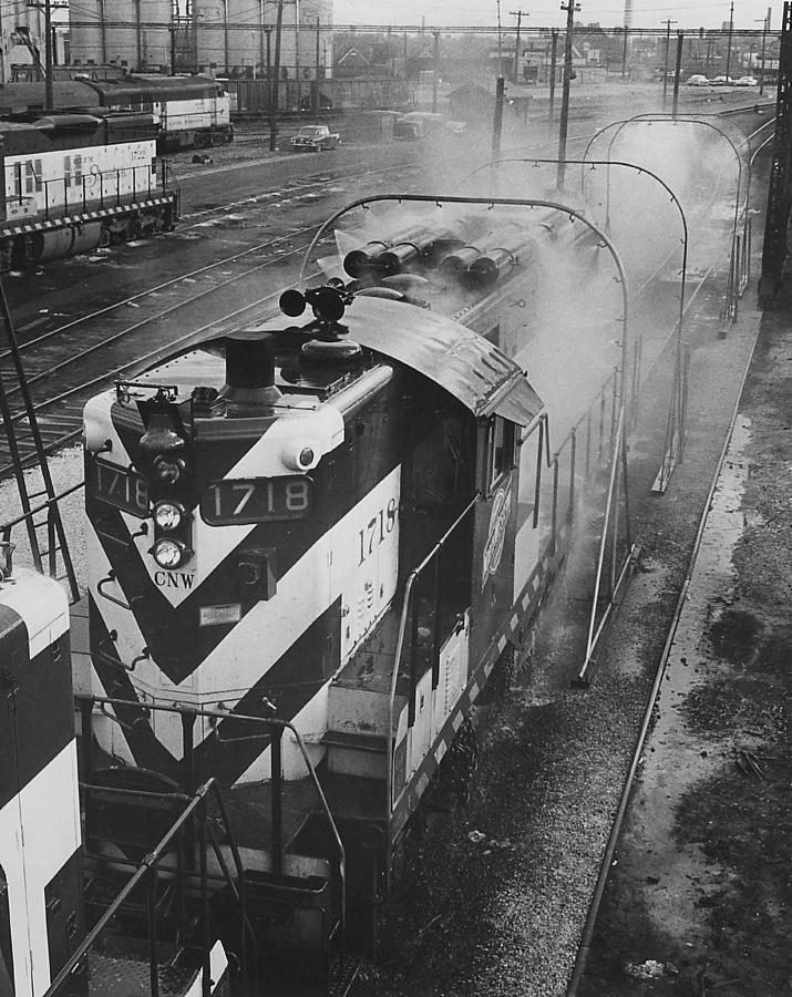 Diesel Engine 1715/1718 Goes Through Wash - 1957   Photograph by Chicago and North Western Historical Society
