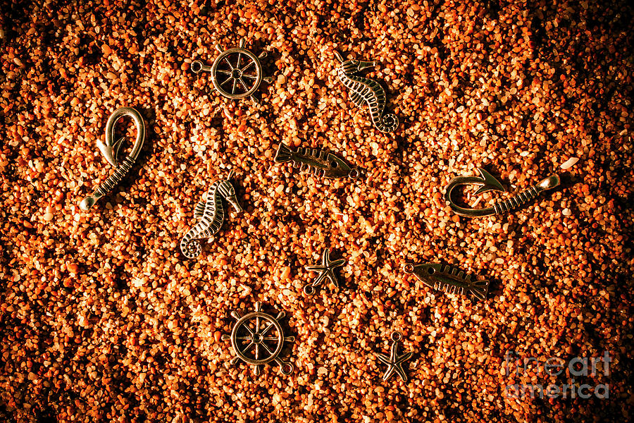 Different marine pendants on sand Photograph by Jorgo Photography