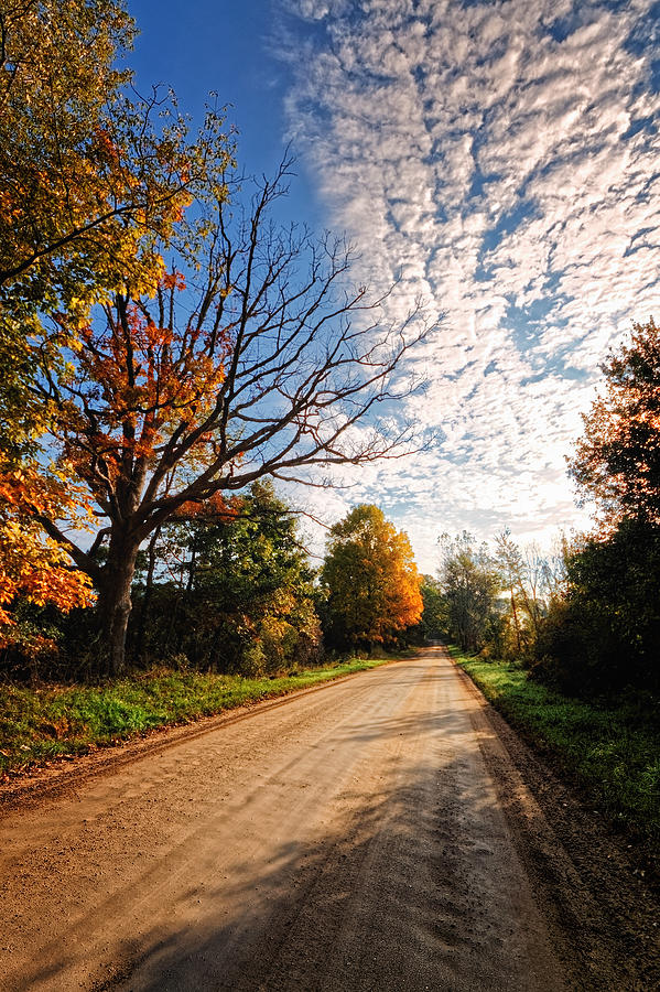 Dirt Road and Sky in Fall Photograph by Lars Lentz
