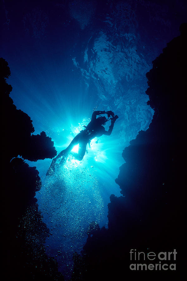 Diver In Lava Cave Photograph by Ed Robinson - Printscapes