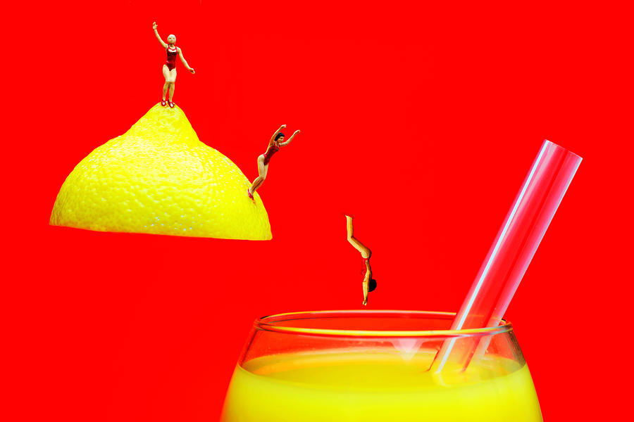 Diving into orange juice Photograph by Paul Ge