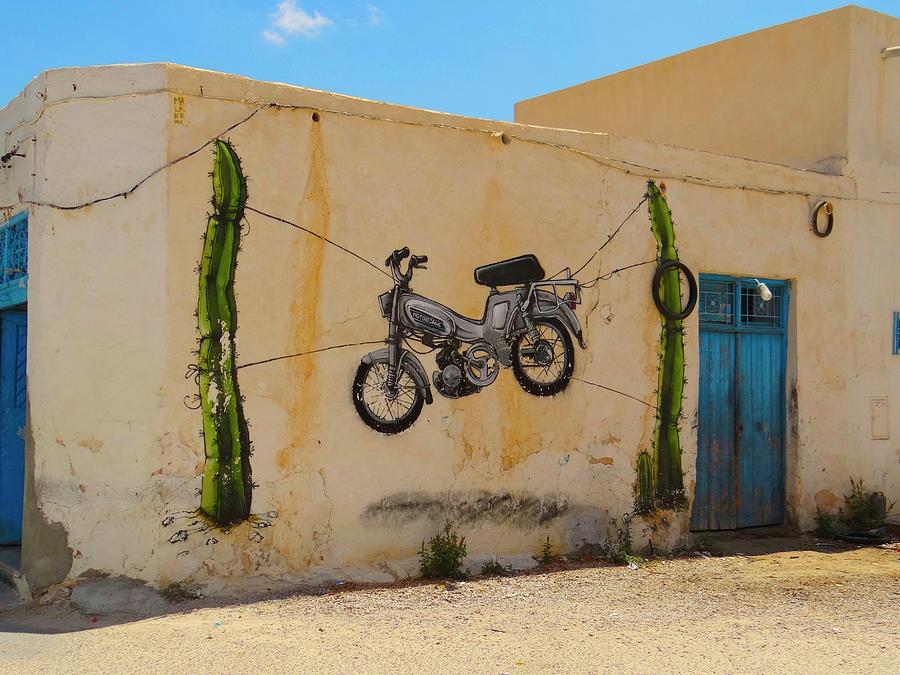 Unschooling Photograph - Djerba Street Art Hanging Bike by Exploramum Exploramum Unschooling Photograph - Djerba Street Art Hanging Bike by Exploramum Exploramum