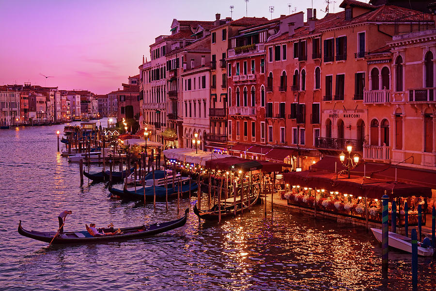 A cityscape with vintage buildings and gondola - From the Rialto in ...