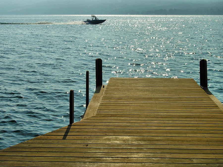 Dock and Speedboat Photograph by Steven Ainsworth