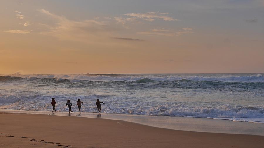 Beach Photograph - Dodging Waves by Steffani Cameron
