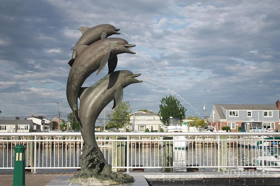 Dolphin Fountain On The Nautical Mile In Freeport Long Island Photograph by John Telfer
