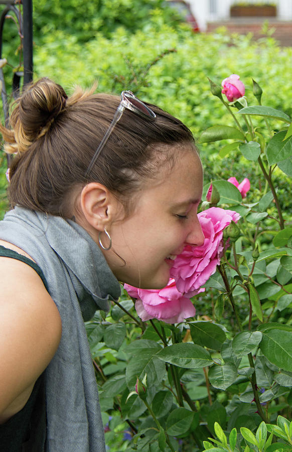 Flower Photograph - Beautiful Girl Smelling Flowers by John Black