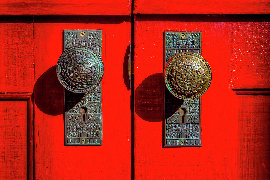 Doorknobs On Red Door Photograph by Garry Gay
