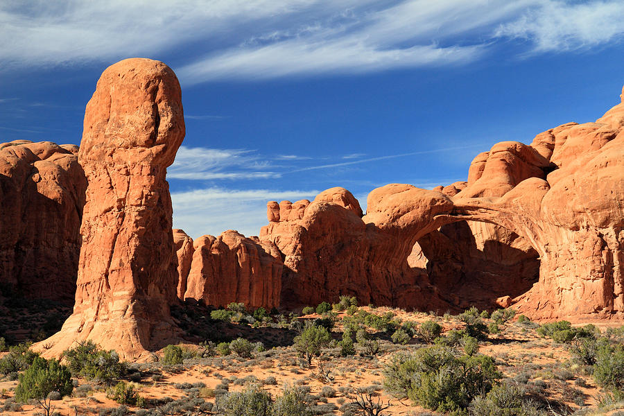 Double arch and monument in Arches National park Photograph by Pierre ...