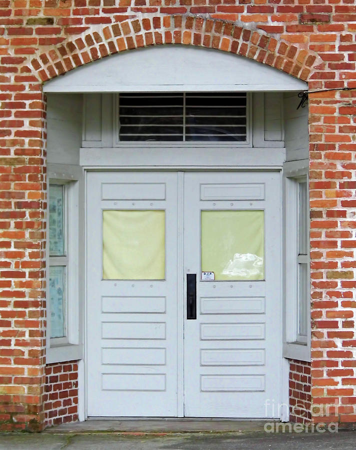 Double Doors In The Brick Building Photograph by D Hackett