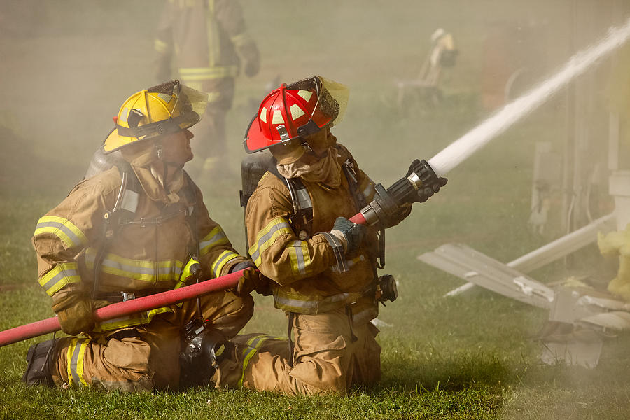 Dousing the Flames Photograph by Todd Klassy