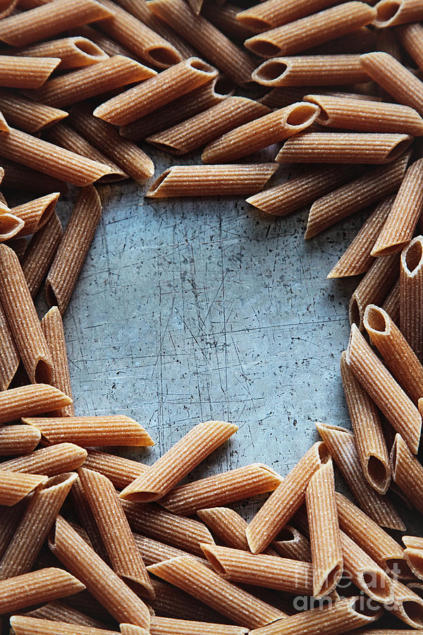 Dry pasta on aluminum Photograph by Sandra Cunningham