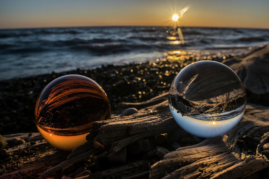 Dual Glass Balls At Sun Rise On A Beach  Photograph by Sven Brogren
