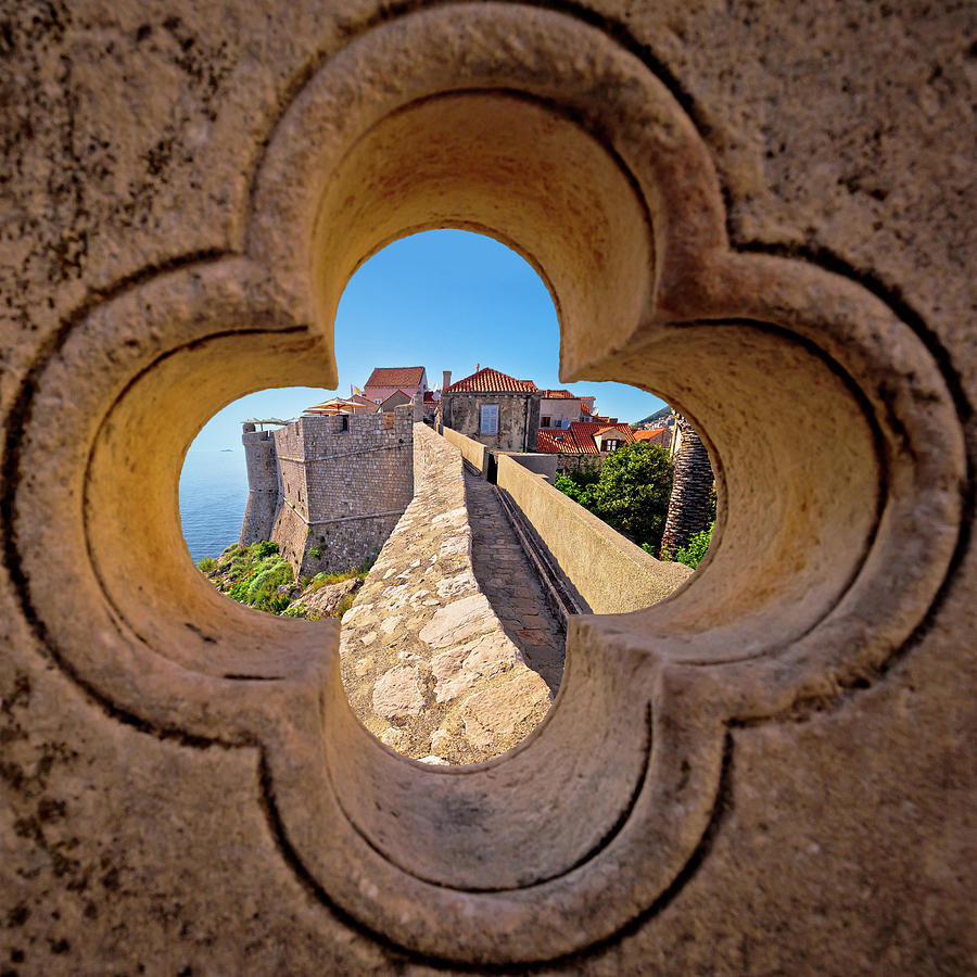 Dubrovnik city walls view through stone carved detail Photograph by Brch Photography