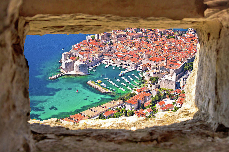 Dubrovnik historic city and harbor aerial view through stone win Photograph by Brch Photography